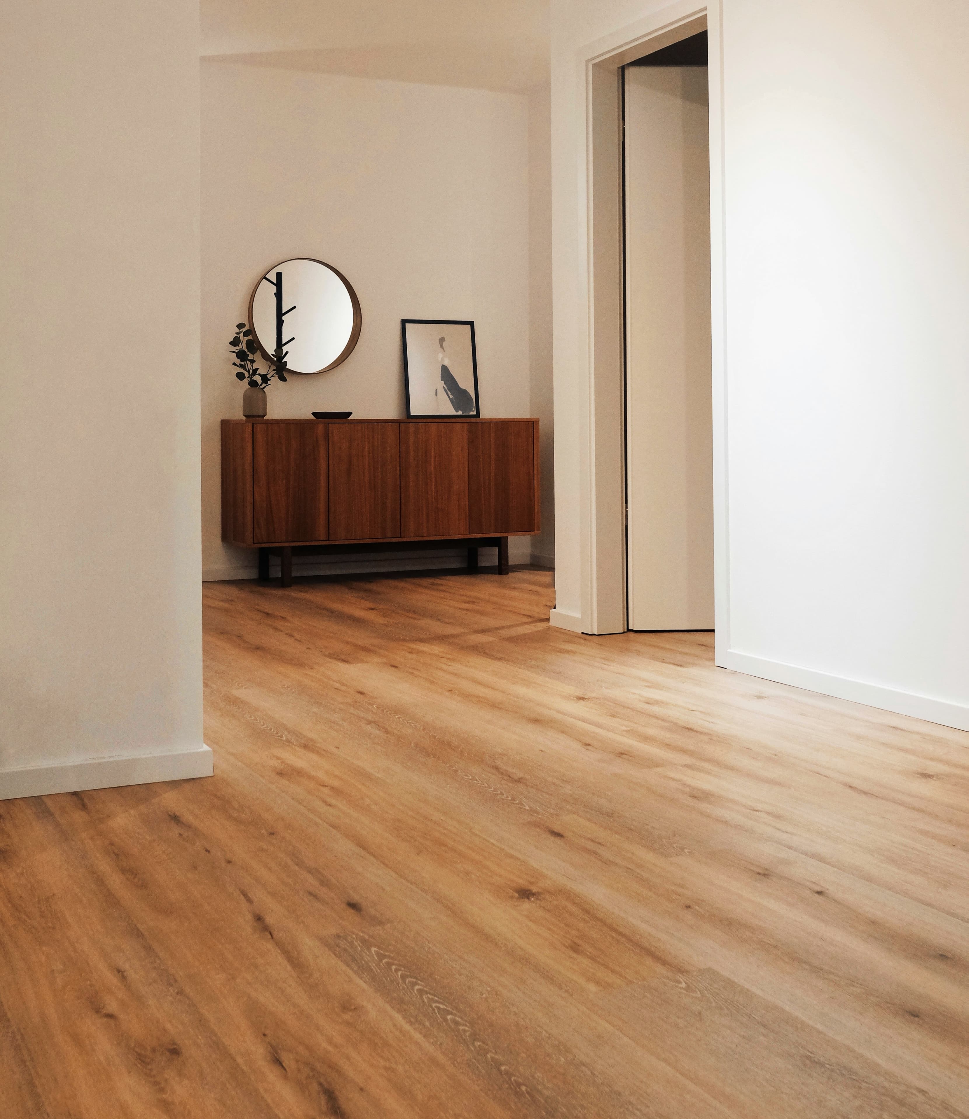 Modern interior with sideboard and wood flooring